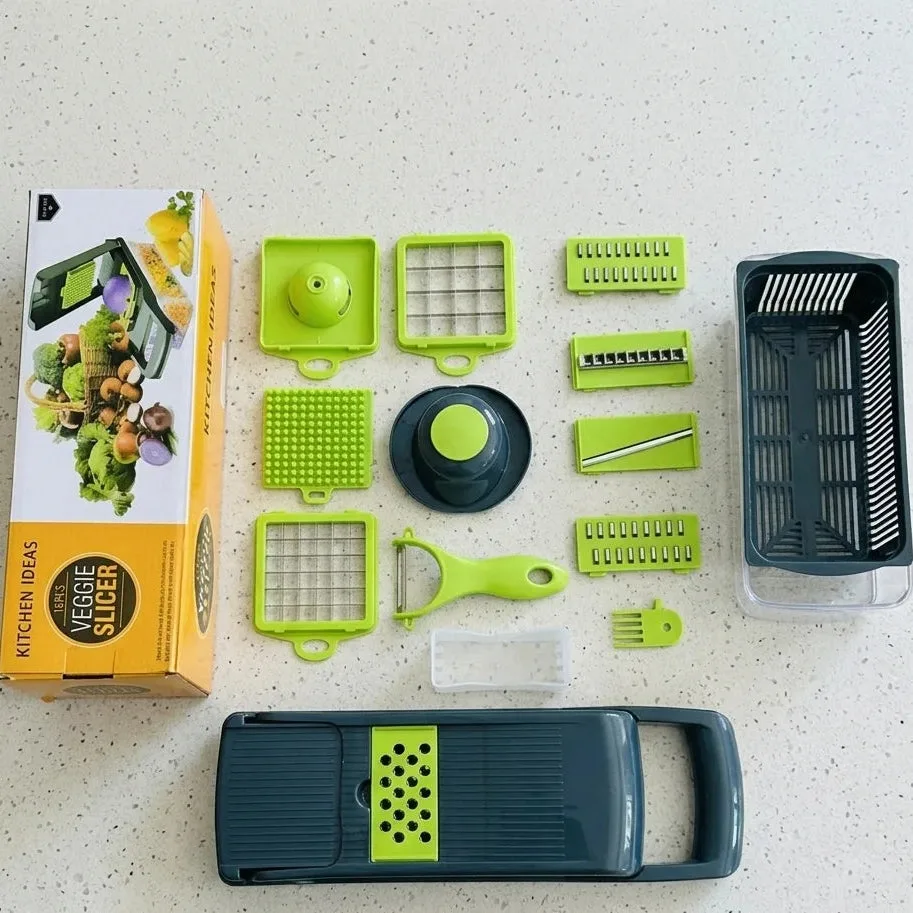 All 16 pieces of the Vegetable Cutter set laid out next to its retail packaging on a kitchen counter