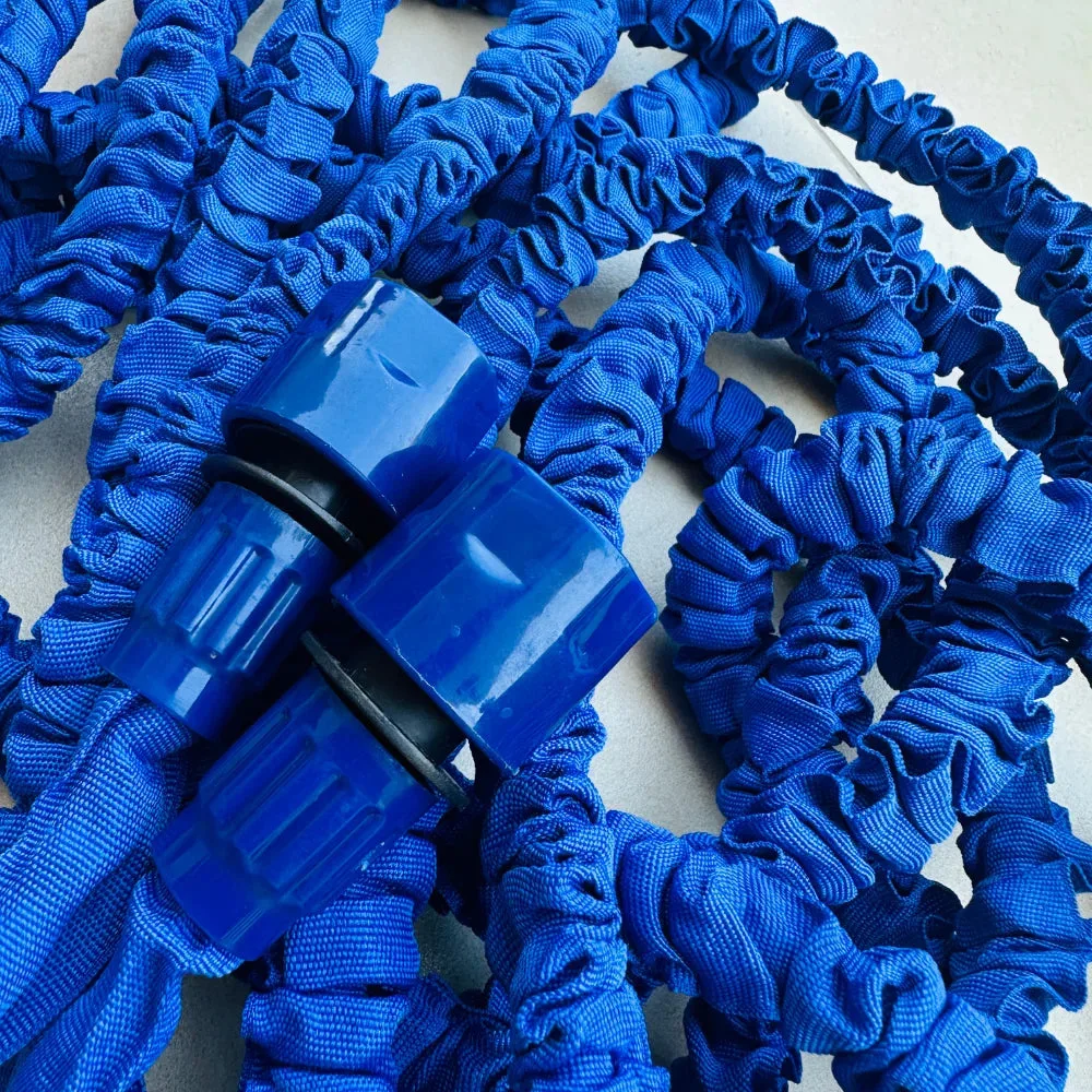 Close-up of the Expandable Magic Hose's brass quick-connect coupling between hose sections
