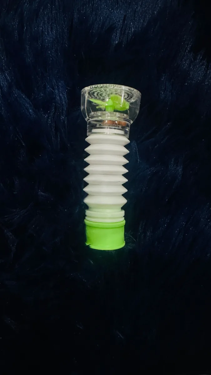 Close-up of the Splash Filter's internal spinning flow reducer and accordion hose connector